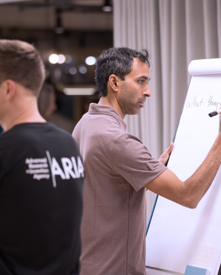Suraj Bramhavar writing on a whiteboard