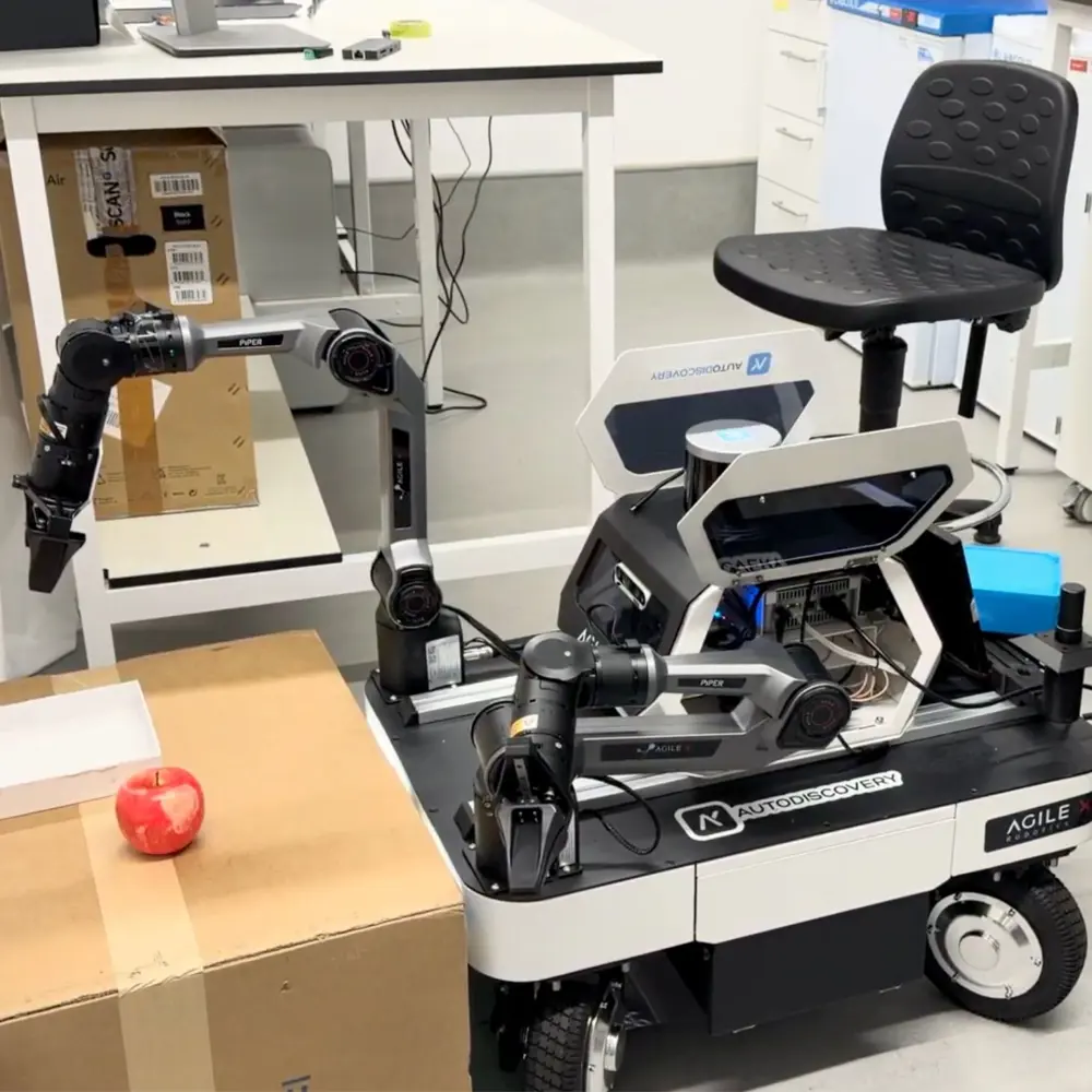 A robot doing a demo with an apple