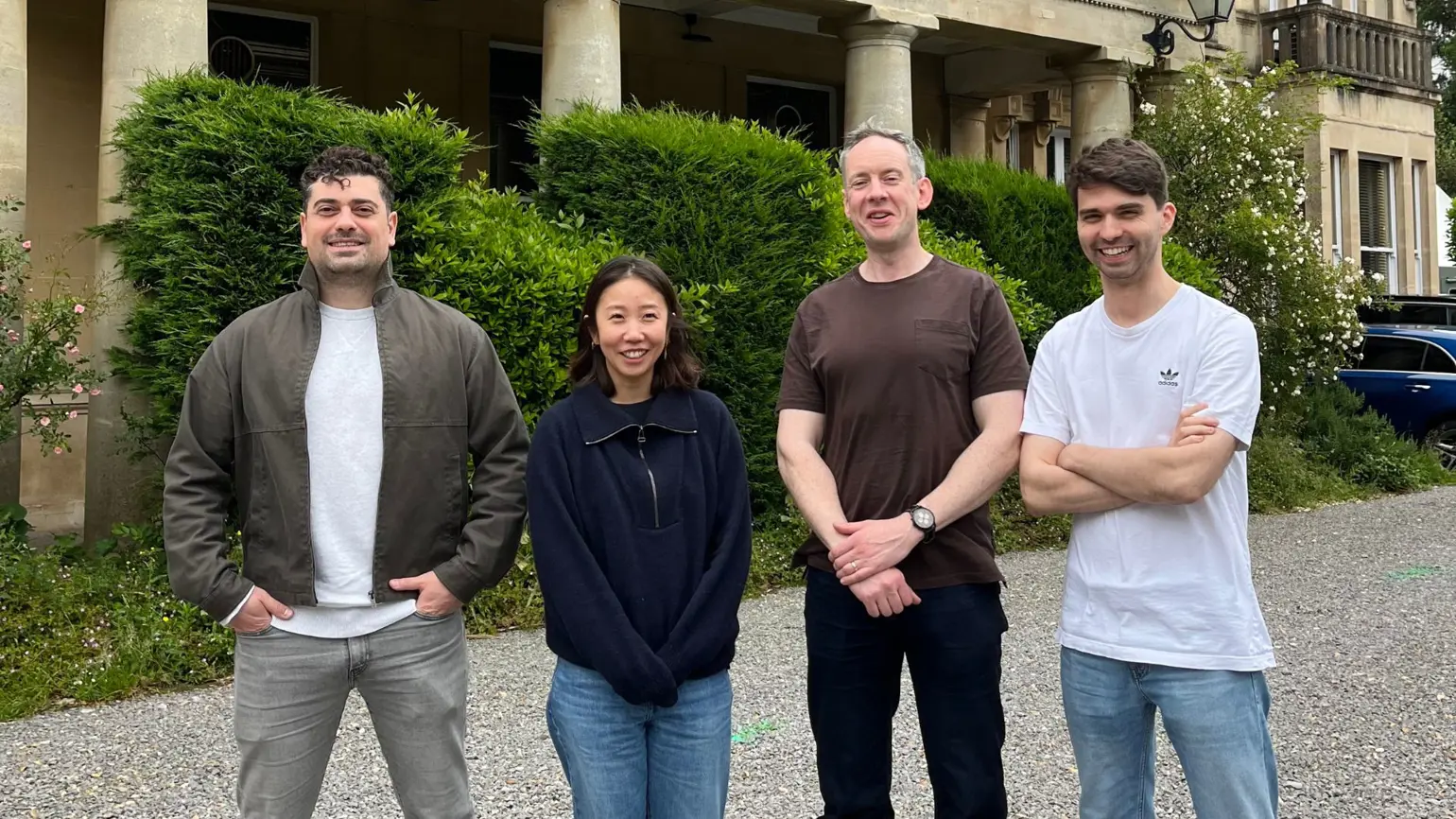 A photograph of the HASH team standing outside a building. Chris, Dora, Ciaran and Dei from HASH (left-to-right)