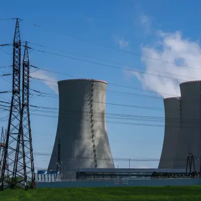 Nuclear power plant with cooling towers and transmission lines